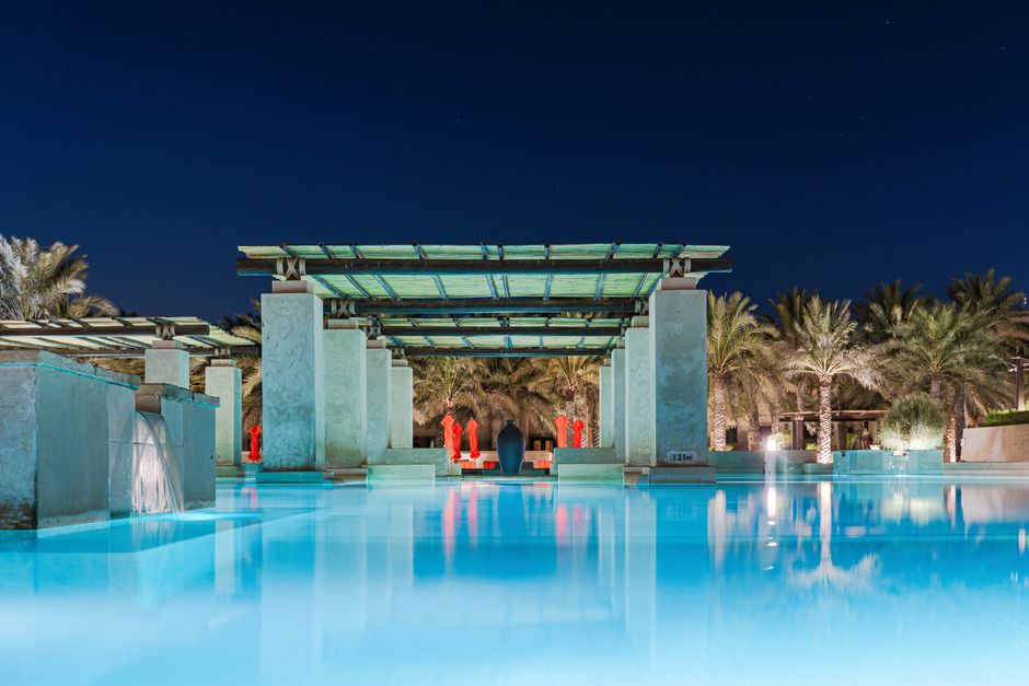 Stunning luxury resort in Oman with traditional architecture and a pool overlooking the sea