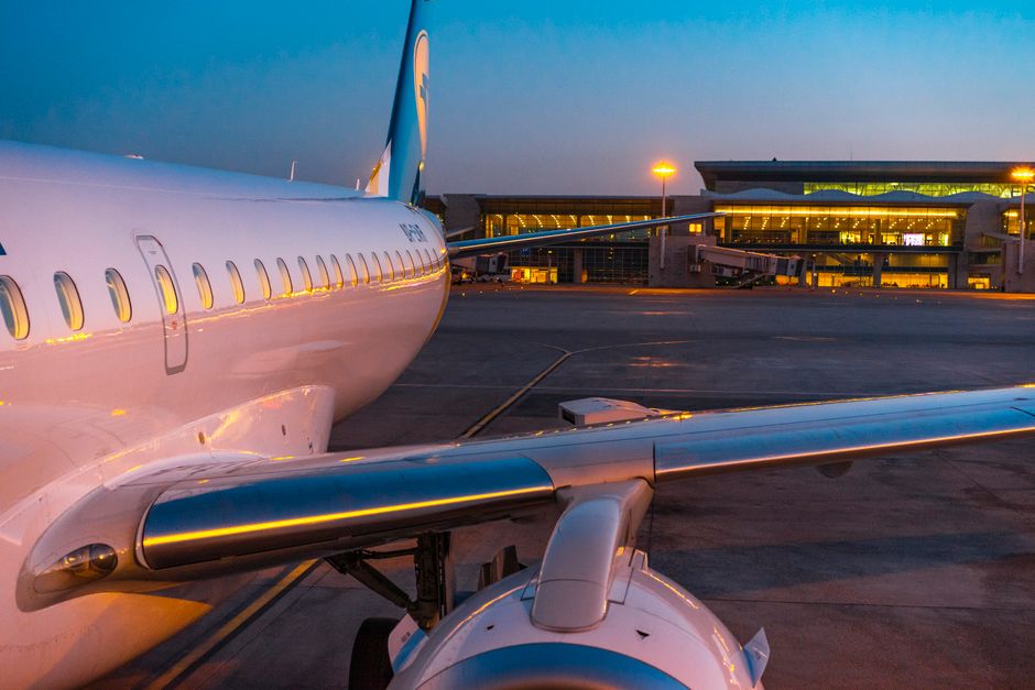 Modern terminal building of Muscat International Airport in Oman at sunset