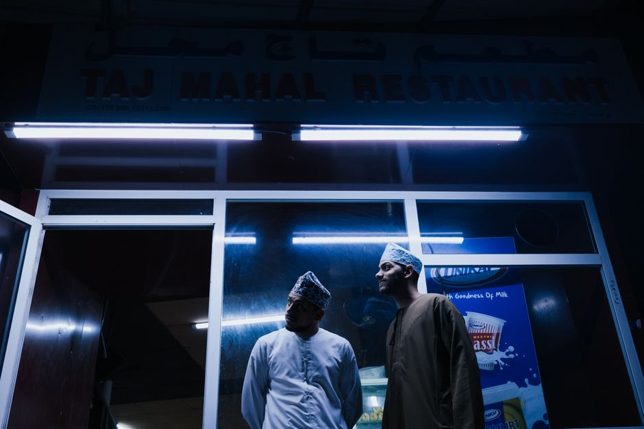 Bustling traditional souq in Oman with local goods and people