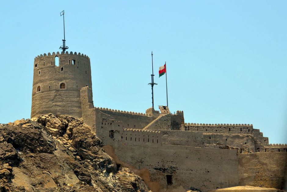 Royal Oman Police car on patrol in Muscat, Oman, symbolizing safety services.