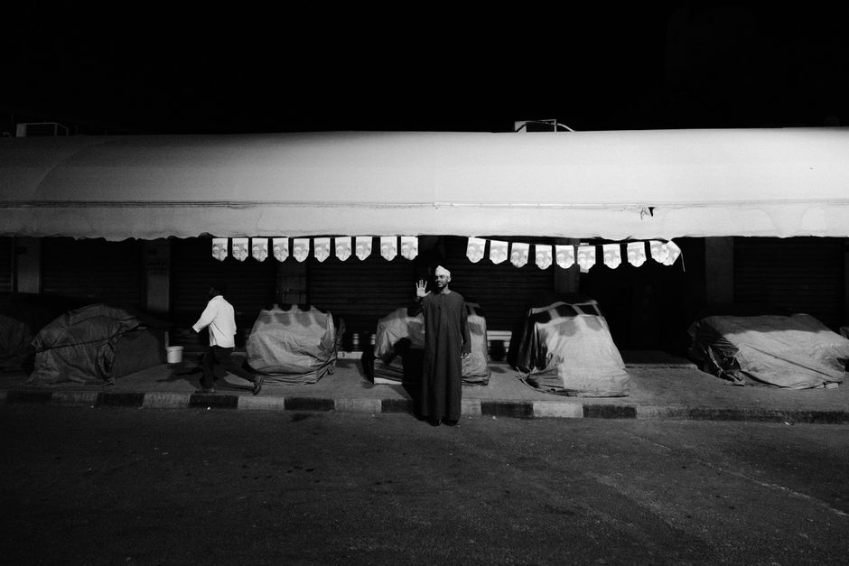 A bustling scene inside Muttrah Souq in Muscat, Oman, with traditional goods and shoppers