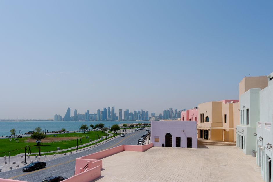 Luxurious hotel overlooking the modern Doha skyline in Qatar at sunset