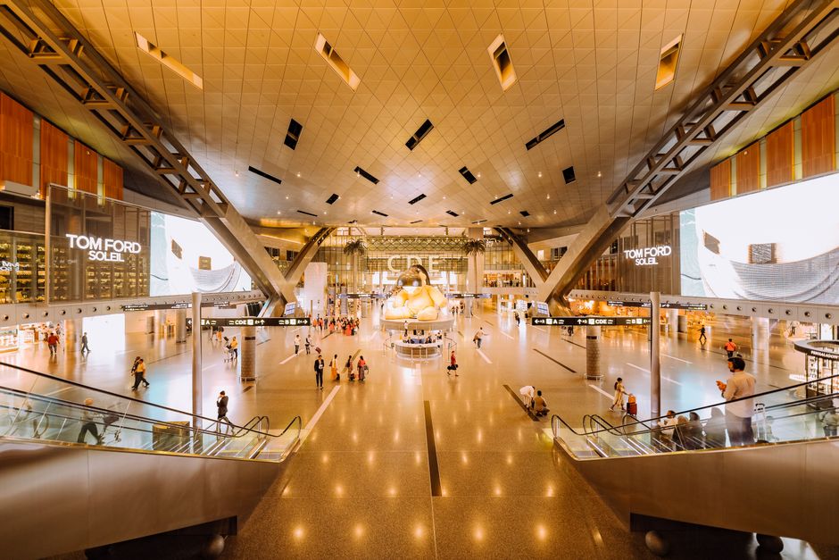 Tourist purchasing a SIM card at a kiosk in Hamad International Airport, Qatar
