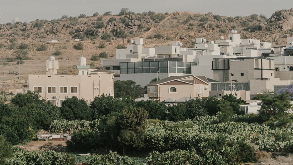 Modern skyline of Riyadh, Saudi Arabia, with traditional architecture in the foreground