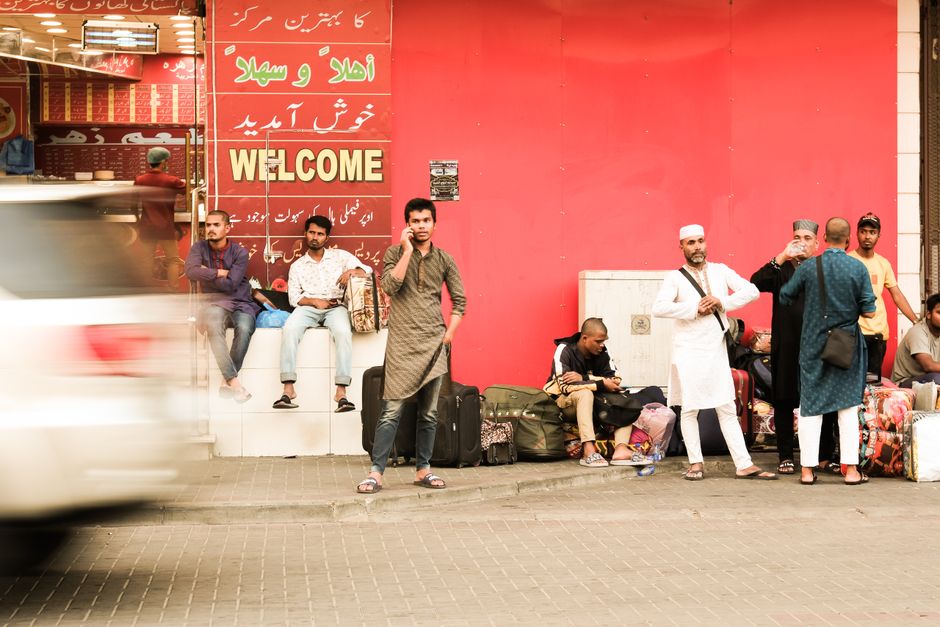 Traveler purchasing a SIM card at King Khalid International Airport in Saudi Arabia
