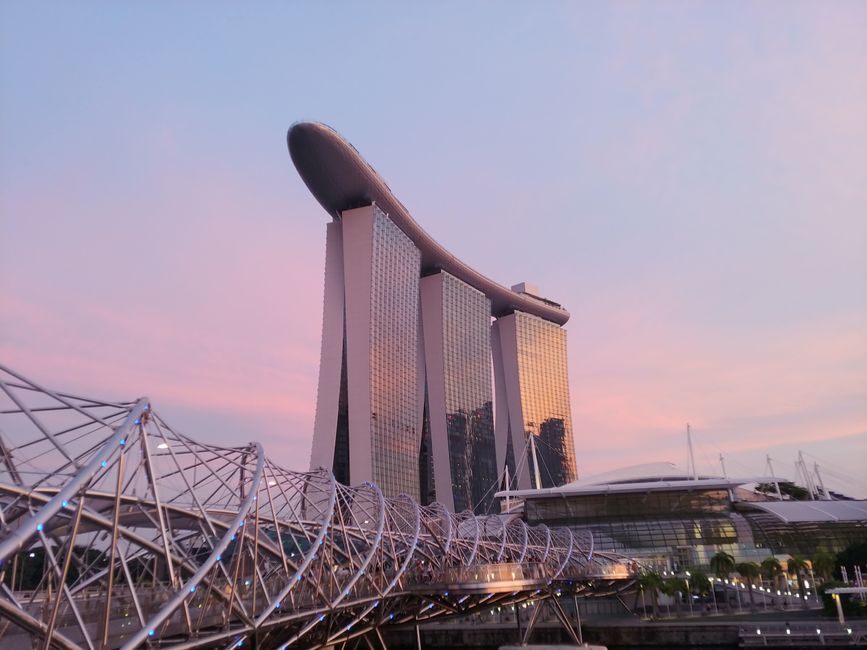 Iconic Singapore skyline with Marina Bay Sands and Supertrees at sunset