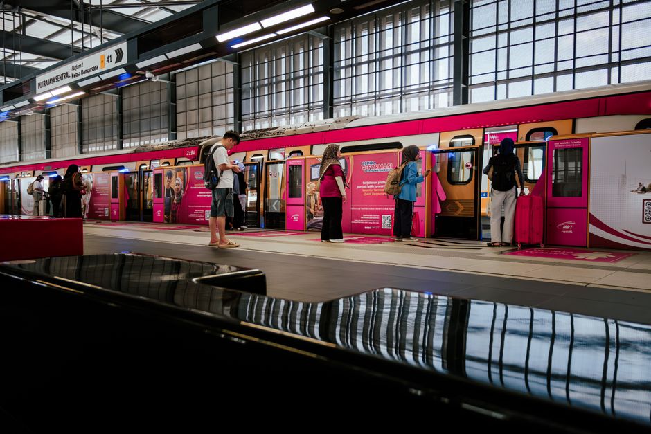 Modern MRT train arriving at a station in Singapore, showcasing efficient public transport