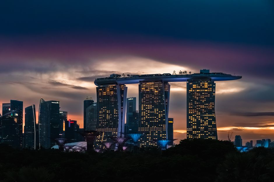 Iconic Marina Bay Sands skyline and Supertrees in Singapore at sunset