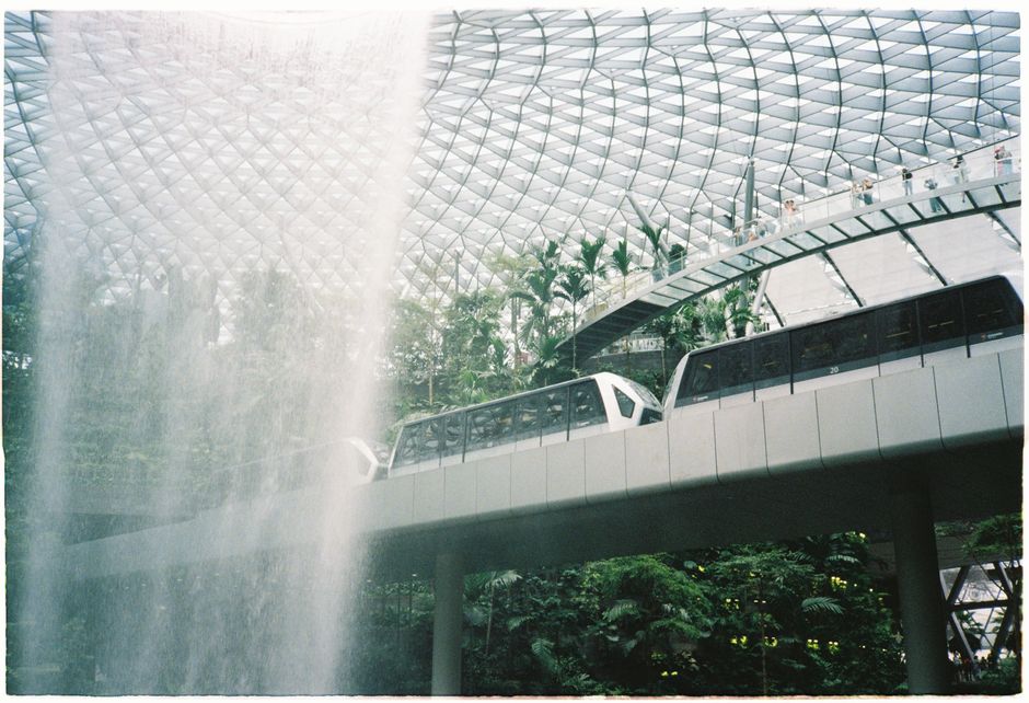 Modern MRT train arriving at a sleek station in Singapore, showcasing efficient public transport