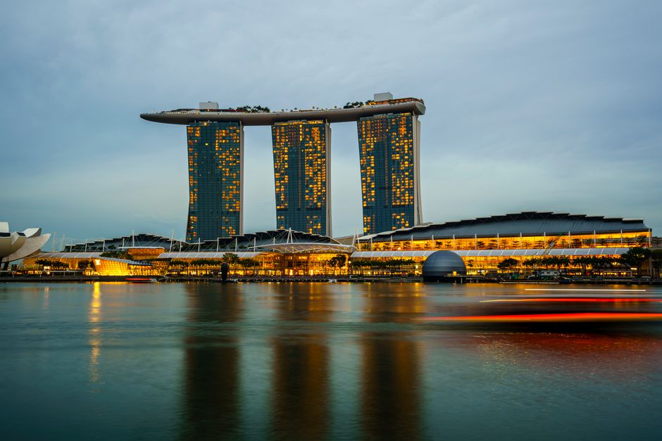 Stunning Singapore skyline with Marina Bay Sands at sunset, symbolizing a secure and enjoyable trip.
