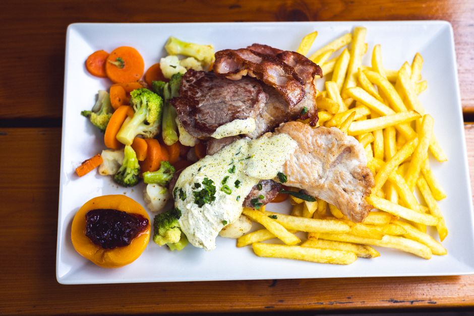 A plate of traditional Slovak Bryndzové halušky with sheep cheese and bacon bits, in Slovakia