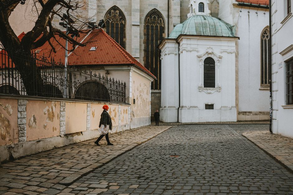 Tour group exploring Bratislava Old Town square in Slovakia with a local guide