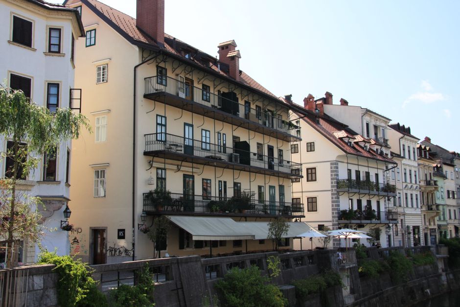 Charming hotel exterior in a picturesque Slovenian town, inviting travelers to stay.