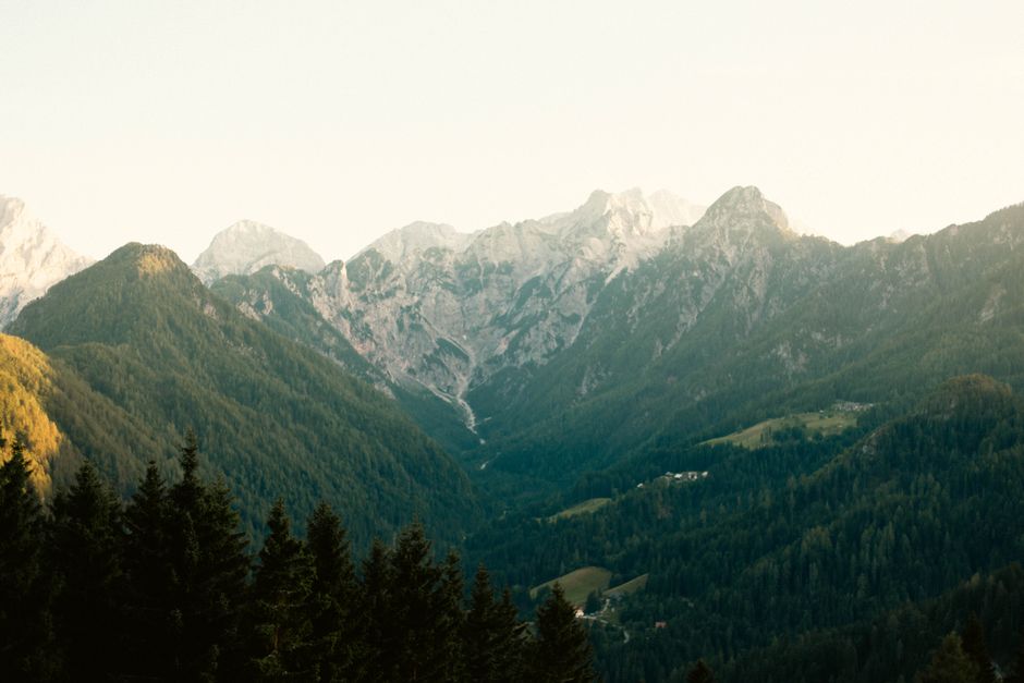 A winding scenic road through the Julian Alps in Slovenia with mountains and green valleys