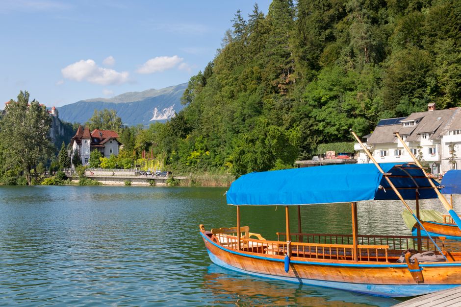 Traditional Pletna boat on Lake Bled, Slovenia, heading towards the island church