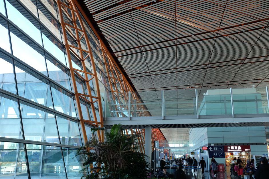 Modern terminal at Incheon International Airport, South Korea, with travelers