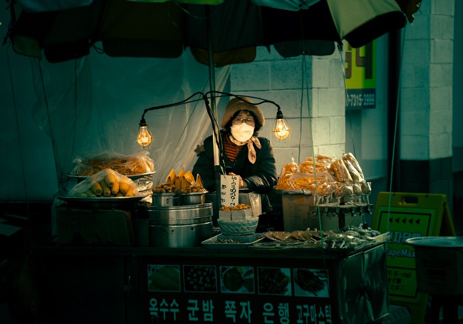 Vibrant Gwangjang Market in Seoul, South Korea, bustling with people enjoying street food