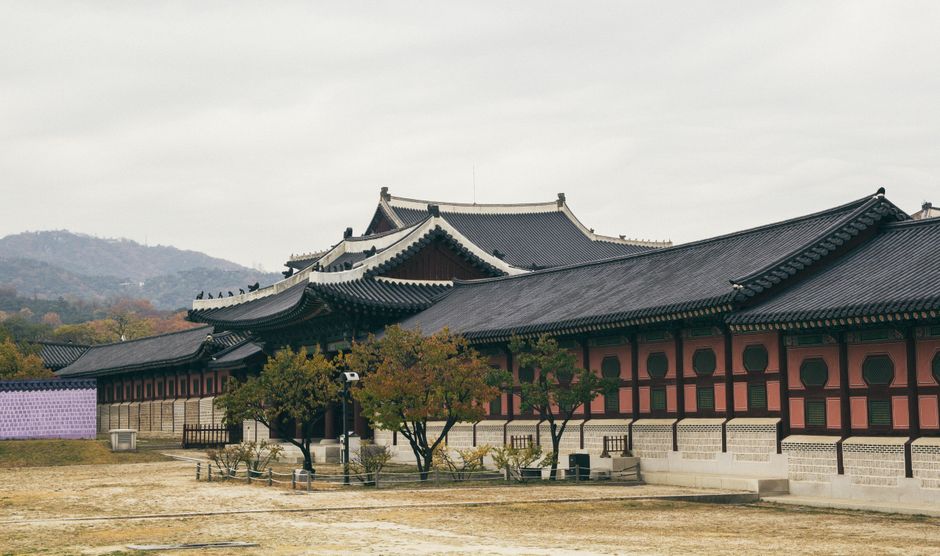 Tourists in traditional Hanbok at Gyeongbokgung Palace in Seoul, South Korea