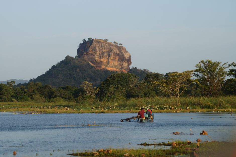 Majestic Sigiriya Rock Fortress at sunrise in Sri Lanka, surrounded by lush greenery