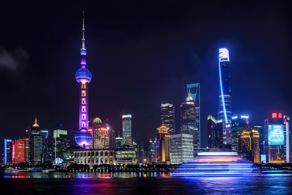 Modern Shanghai skyline at dusk in China, showcasing bustling city life and innovation.