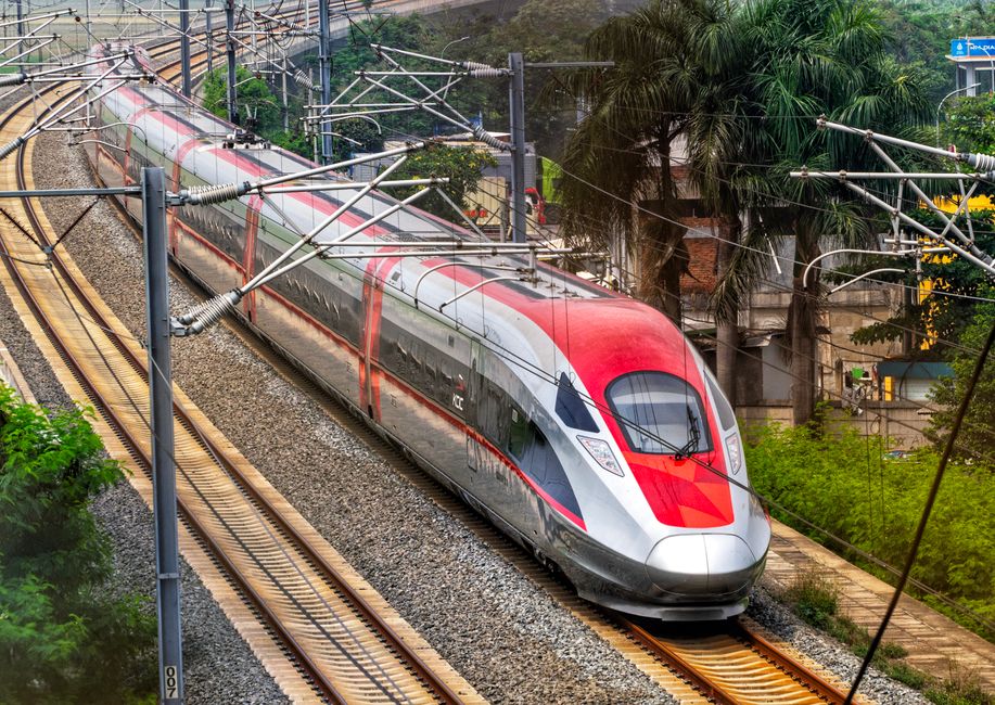 Modern high-speed train at a bustling station in China, ready for a day trip adventure