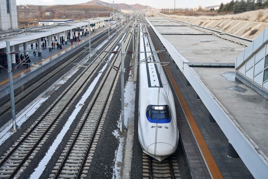 Sleek G-train high-speed rail speeding through the Chinese countryside
