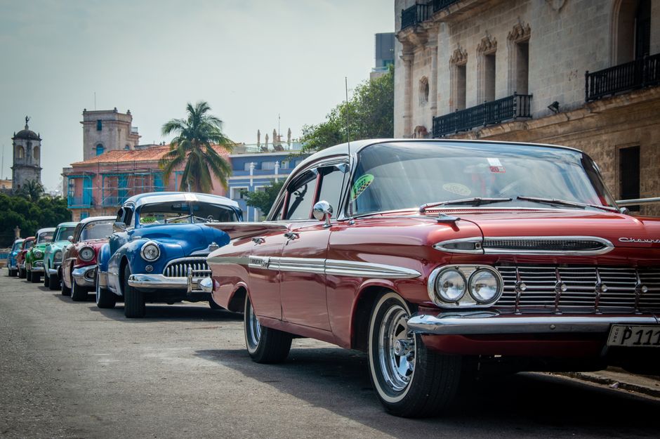 Vintage American car driving through historic Old Havana, Cuba