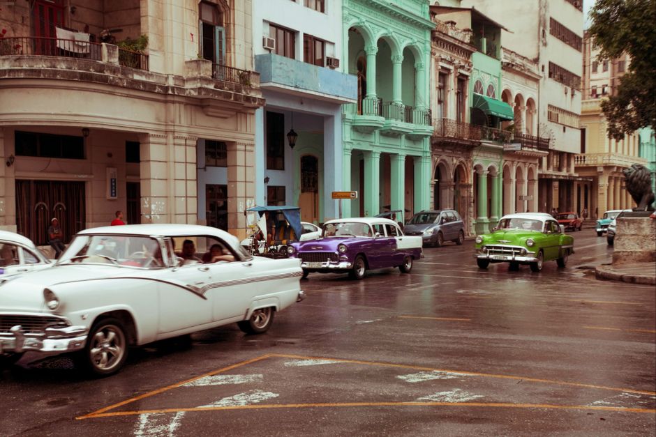 Vibrant street scene in Old Havana, Cuba, showcasing local culture and historic architecture.