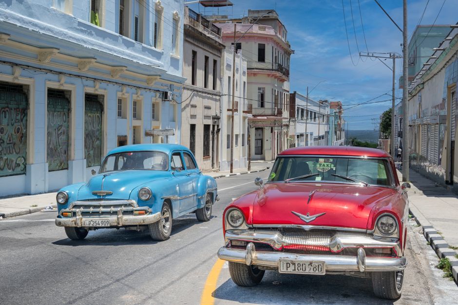 Colorful classic American car operating as a taxi outside Havana Jos
Mart
International Airport, Cuba