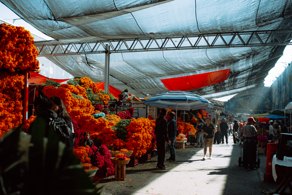 A bustling local market in Jamaica with fresh produce and vibrant colors, showcasing the island's authentic culture.
