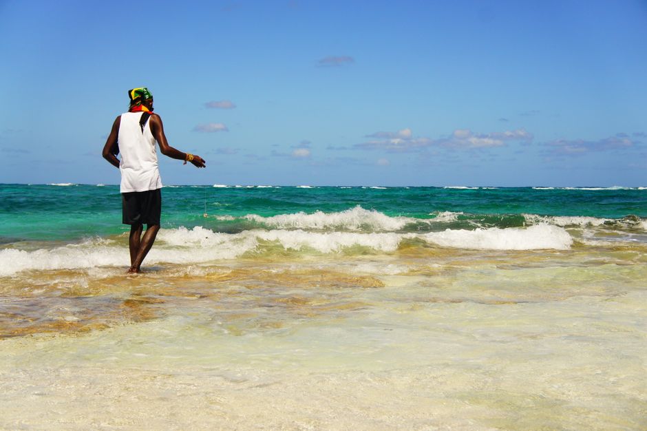 Jamaica Tourist Board representative offering assistance to travelers