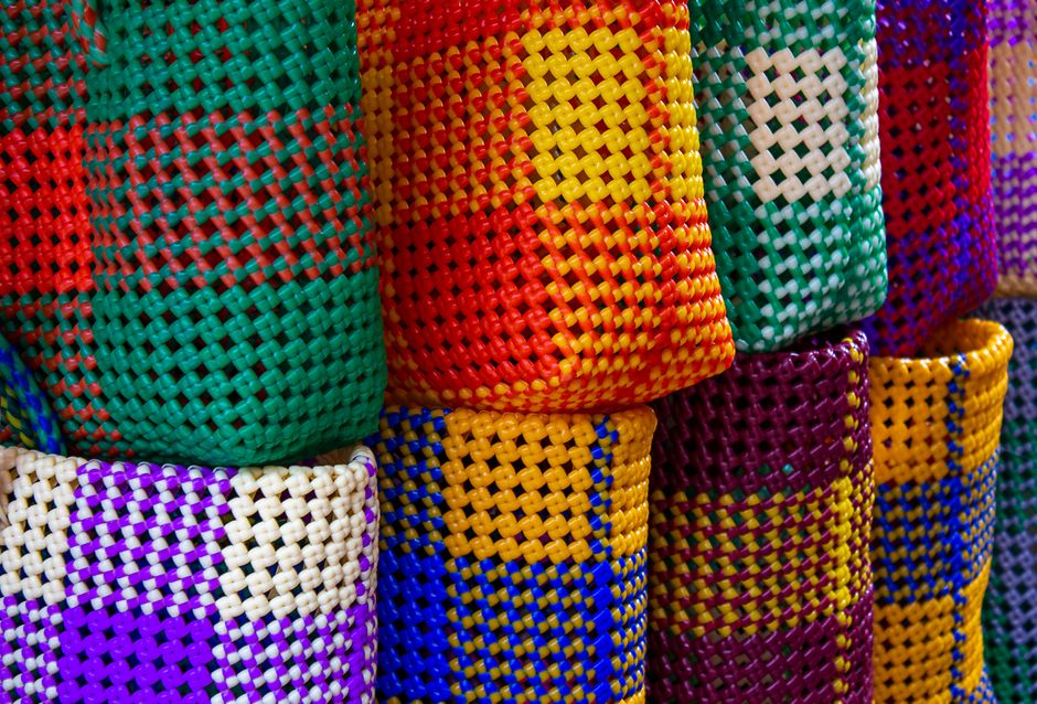 Vibrant craft market stall in Jamaica displaying local handmade souvenirs and art