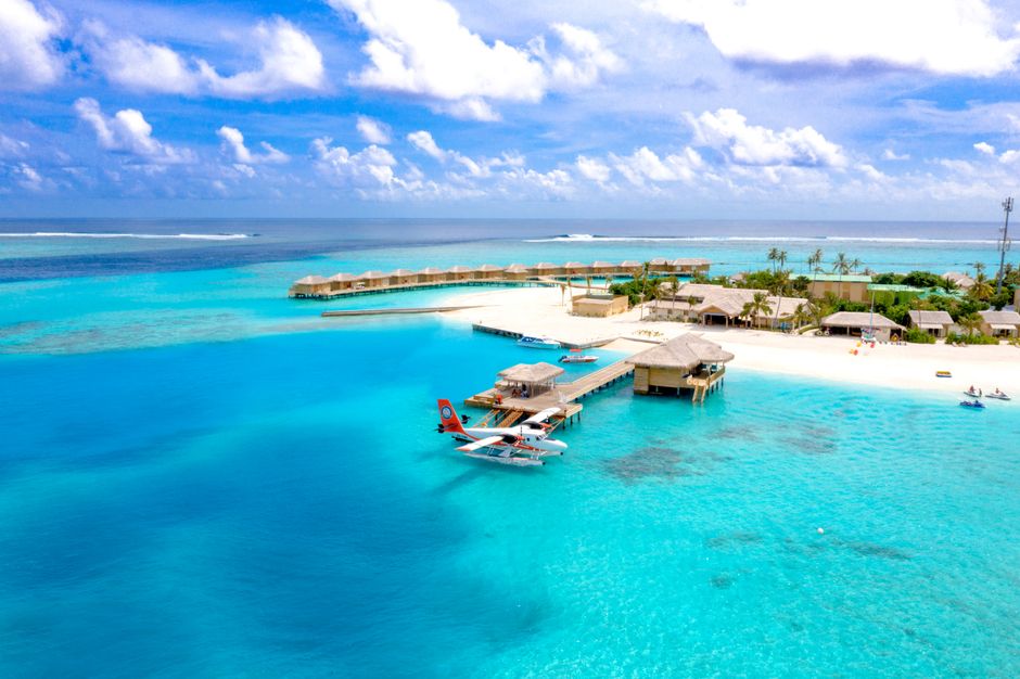 Seaplane landing near a luxury resort in the Maldives, showcasing island transport