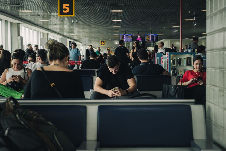 Traveler purchasing a SIM card at a Digicel kiosk in Tocumen International Airport, Panama