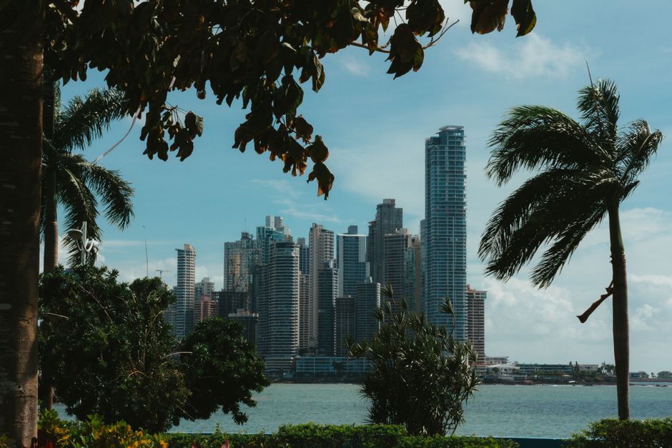 Sunny Panama City skyline with tropical clouds, showcasing the vibrant weather