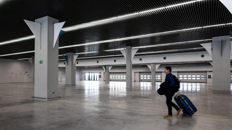 Passengers waiting at a modern airport terminal in Lima, Peru
