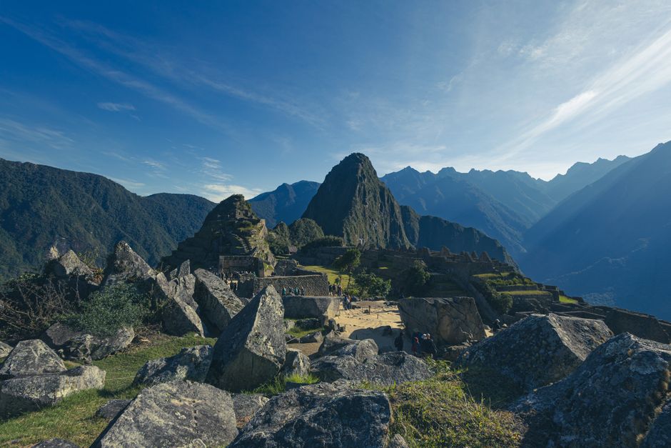 Traveler overlooking Machu Picchu at sunrise, symbolizing peace of mind with Peru travel insurance