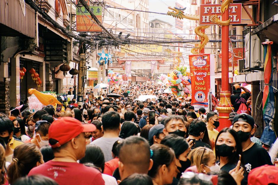 Vibrant street market scene in the Philippines with local vendors and colorful goods