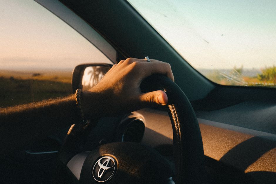 Toyota Vios rental car driving on a scenic road in the Philippines
