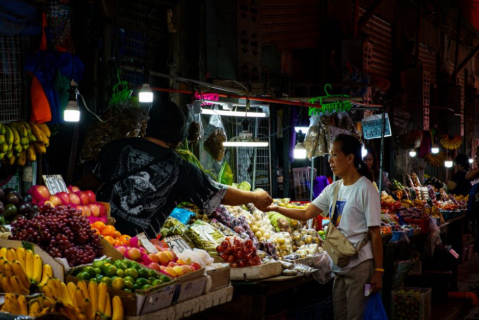 Vibrant street market in the Philippines with local food stalls and people