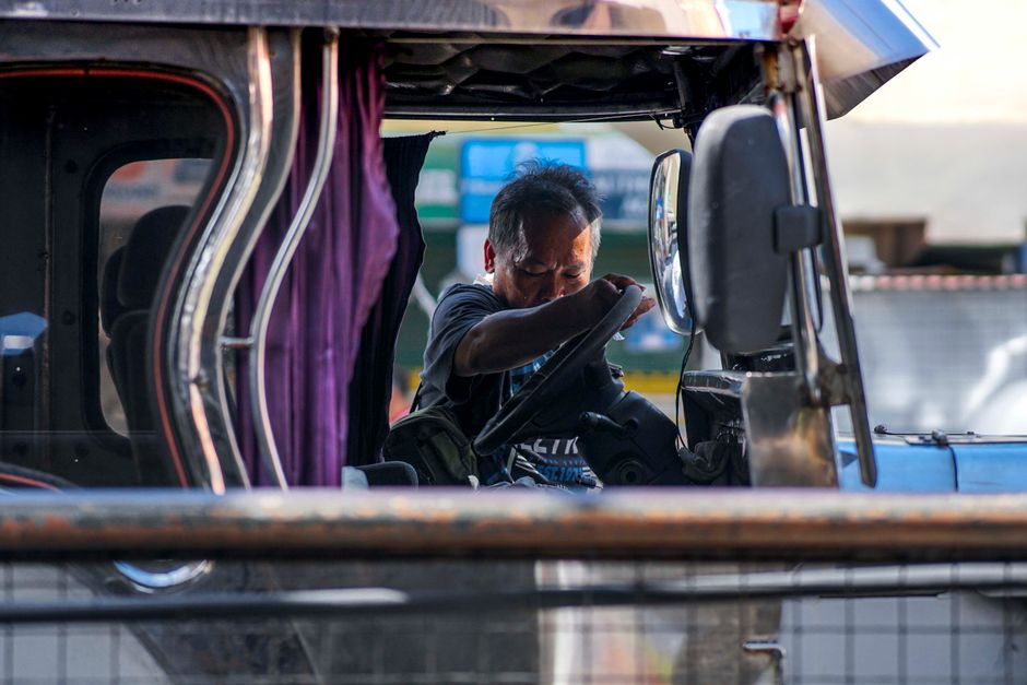 Colorful Jeepney driving on a busy street in the Philippines
