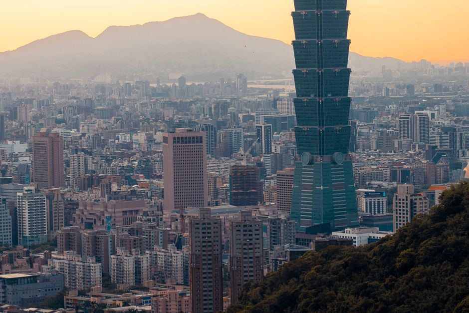 Taipei 101 skyscraper at sunset with city lights in Taiwan