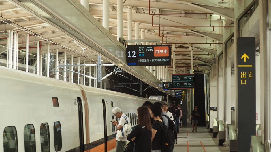 High-speed train speeding through the Taiwanese countryside