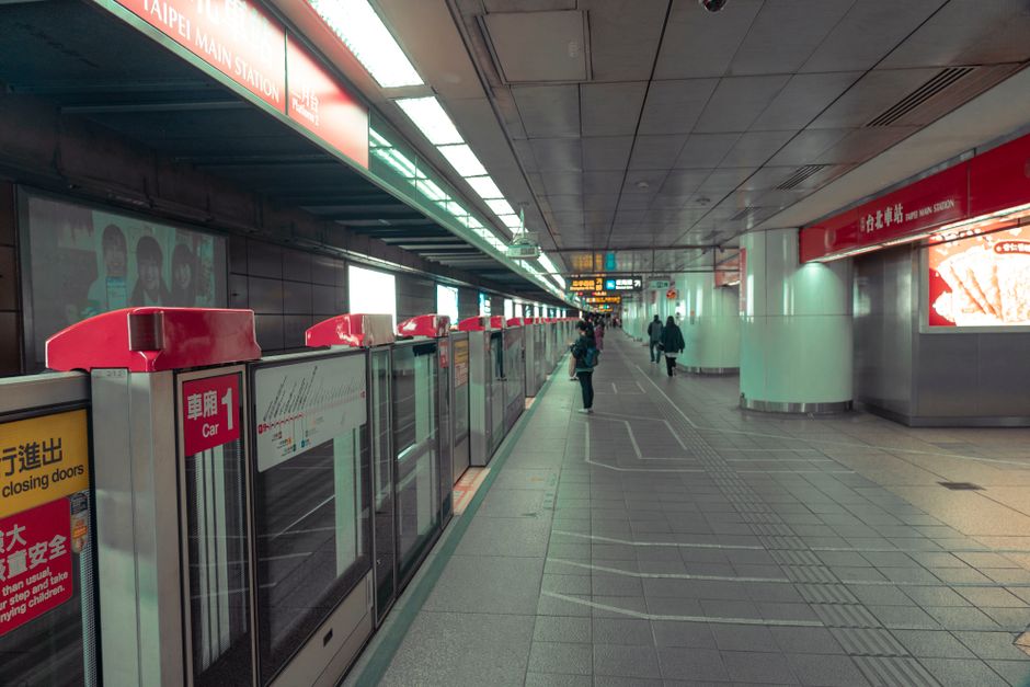 Modern Taipei MRT station platform in Taiwan with arriving train